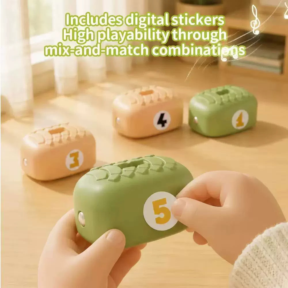 Close-up of yellow and green magnetic snake body segments with number stickers